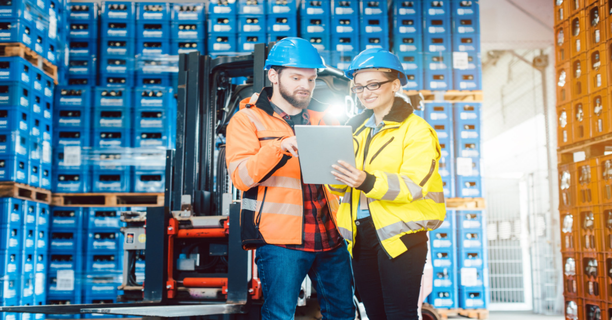 Workers in warehouse checking inventory data – CFO Challenges